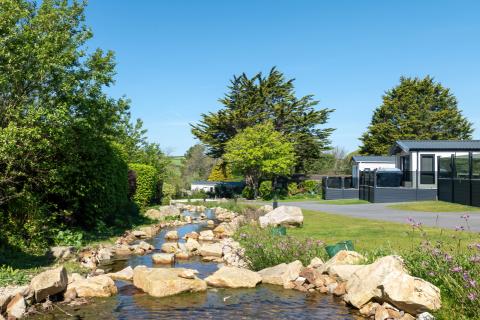 luxury caravans at Silverbow Country Park by the stream