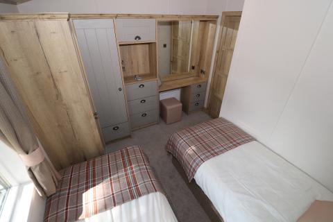 twin bedroom with wardrobes