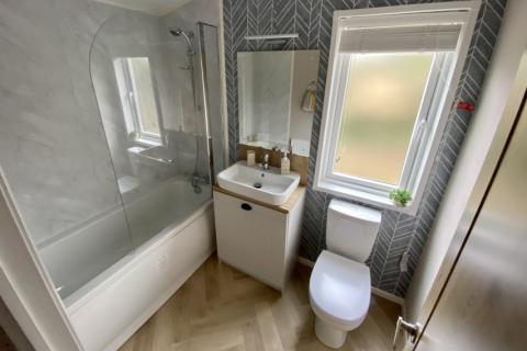 Debonair Lodge with full sized bath and shower over and toilet