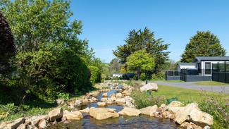 luxury caravans at Silverbow Country Park by the stream