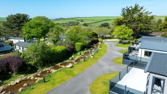 luxury lodges at Silverbow Country Park by the stream