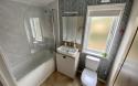 Debonair Lodge with full sized bath and shower over and toilet