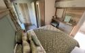 double bedroom with dressing table in the lodge