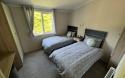 large and luxury twin bedroom in the Swift Edmonton Lodge